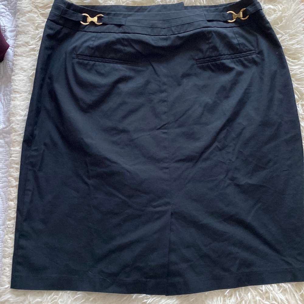 Black skirt. Good details on back